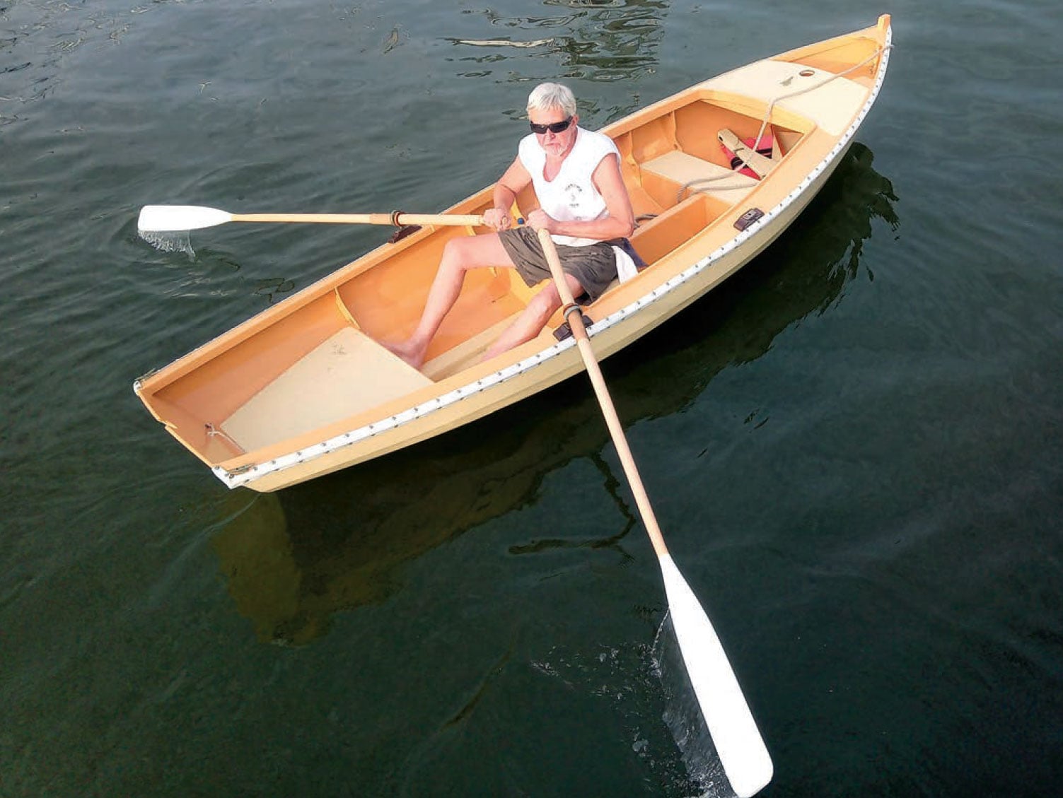 Man rows a Sea Bright skiff.