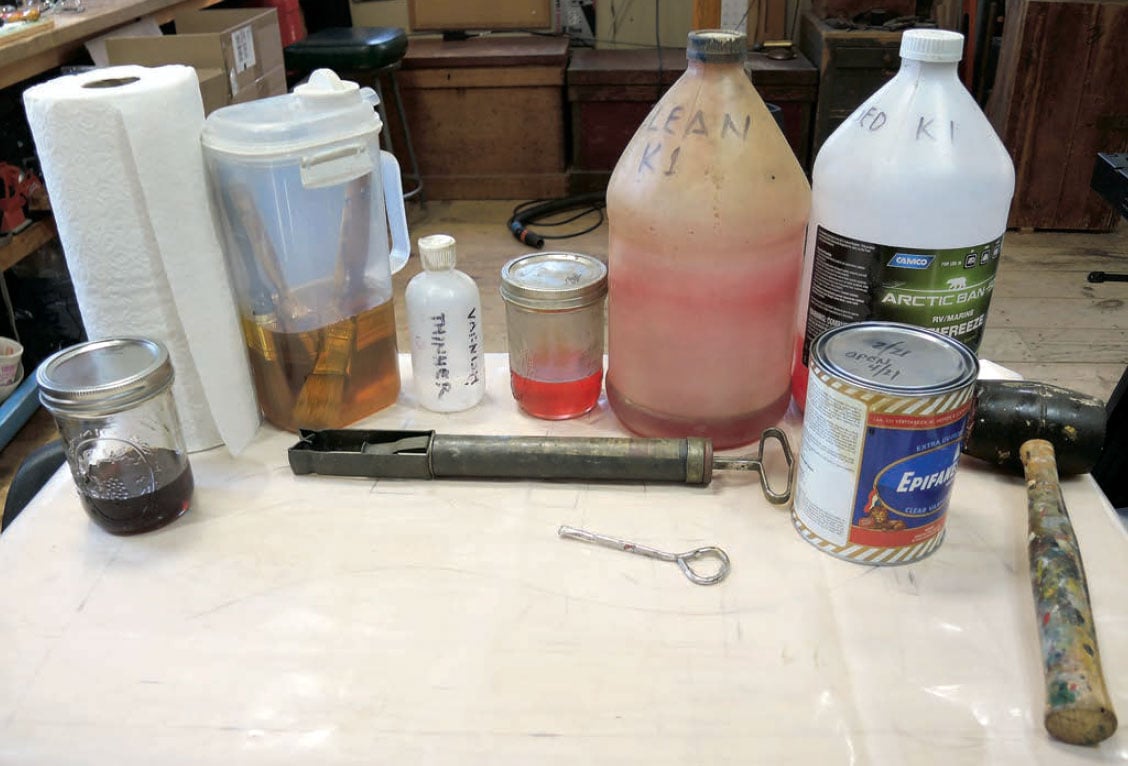Assorted ingredients and equipment for cleaning and maintaining varnish brushes.