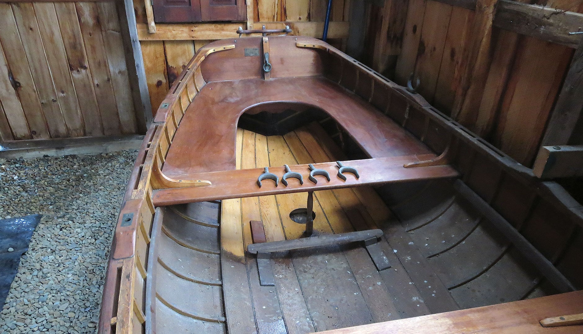 Cleaning the thwarts and the after section of floorboards.