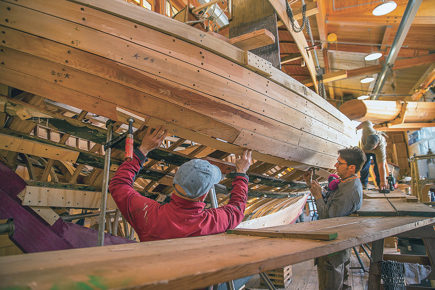 Robert d’Arcy (left) led the reconstruction of the boat.