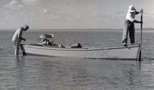 Esperanza Woodring poles her boat.