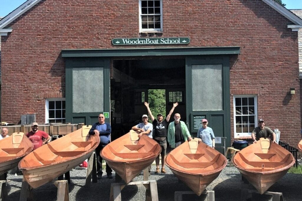 boats in front of a brick building