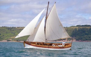 Ocean-racing sailor Conrad Humphries (at the helm), acquired the BOUNTY replica.