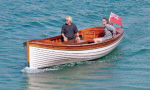 John McShea, at the helm, built the launch HAYDEN, a bespoke wooden launch inspired by historic local types of Salcombe, Devon, England.